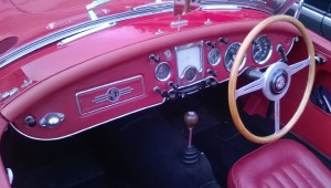 The Twin cam has a fabric covered facia to match the interior trim and a chrome bezel around the radio speaker.