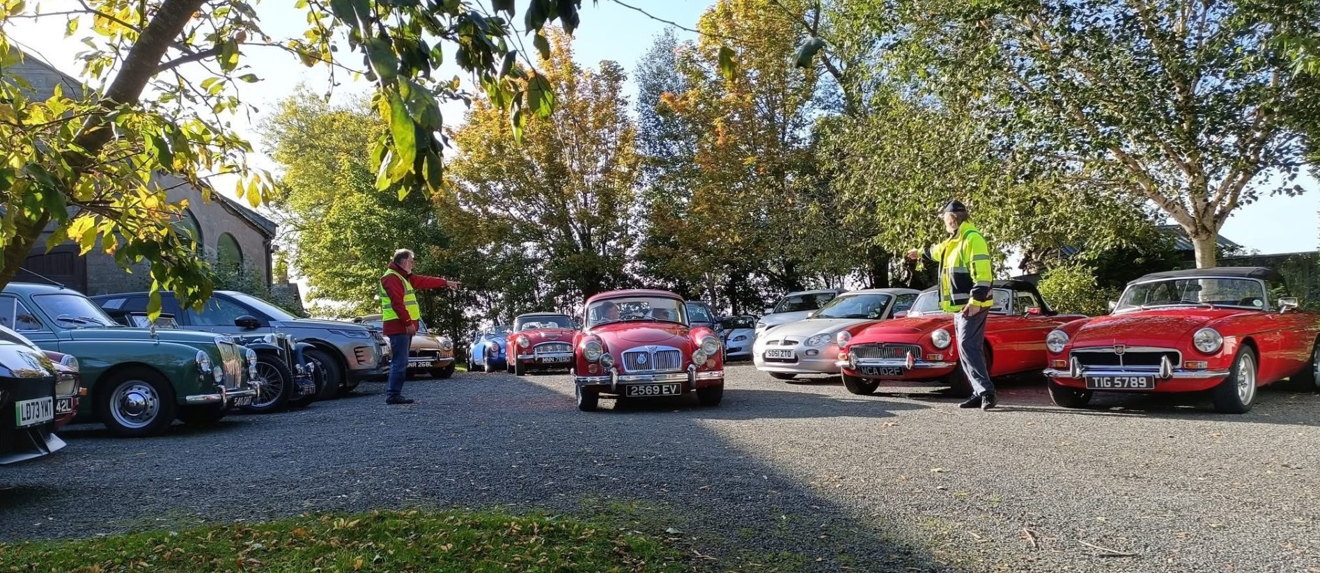 Classic MG cars preparing for a drive